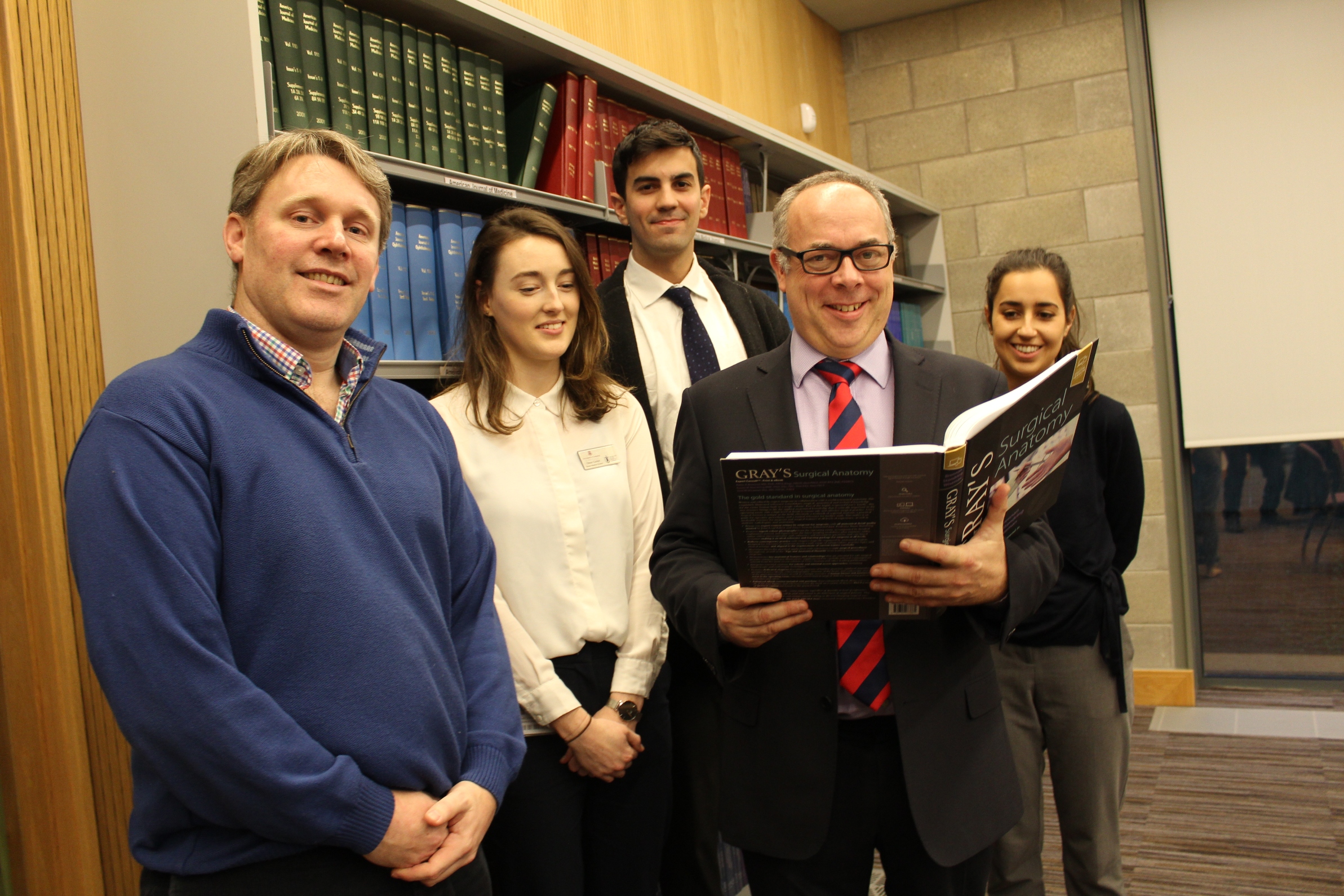 Prof J Calvin Coffey and Gray's Anatomy Prof J Calvin Coffey and team with a copy of Gray's Anatomy